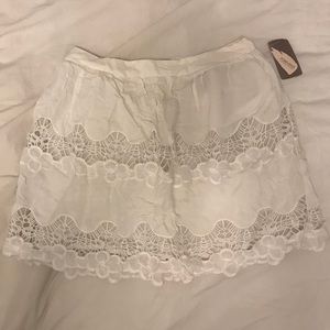 Short white floral skirt